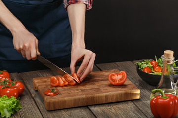 Woman cooking fresh vegetable salad. Female hands. Diet concept for healthy lifestyle with copyspace.