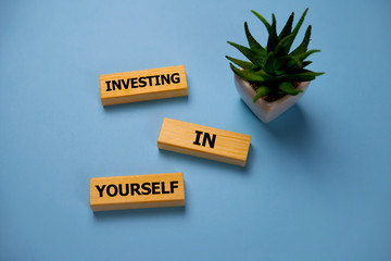 Investing In Yourself - Increase Concept. Inscription on Blue Brick Wall. Investing In Yourself -...