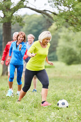 Group of seniors playing football