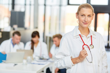 Fototapeta premium Young woman as a competent doctor