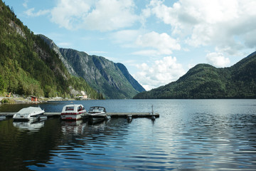 boats in pristan on a mountain river in norway