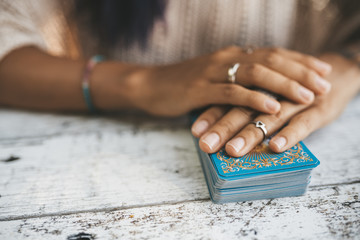 Close uo of female hands with Tarot cards