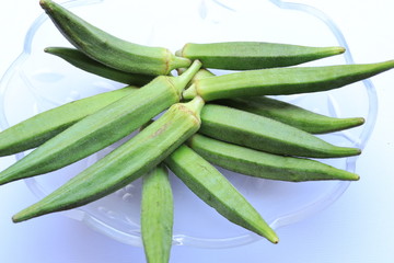 Fresh Young Lady Fingers or Okra in white background
