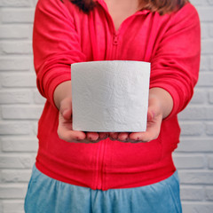 Concept of bowel disease, food poisoning and diarrhea trouble. Girl with toilet paper rolls in...