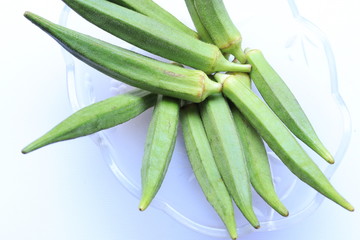 Fresh Young Lady Fingers or Okra in white background
