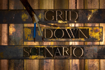 Photo of real authentic typeset letters Grid Down Scenario text on vintage textured grunge copper and gold background with electrical wiring