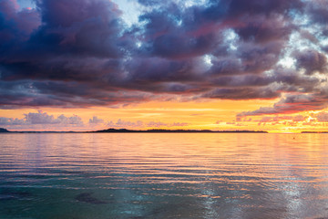 Sunset colorful sky on sea, tropical desert beach, no people, dramatic clouds, travel destination getting away, long exposure Indonesia Sumatra Banyak Islands