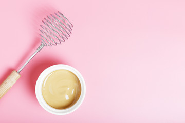  The process of making dalgona coffee on a pink background