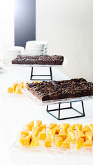 sweet tarts brownies cake on a table buffet break 