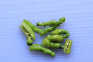 green cayenne pepper with a white background

