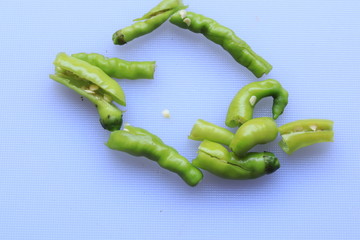 green cayenne pepper with a white background

