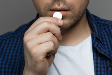 A man with a tablet in his hand. Headache
