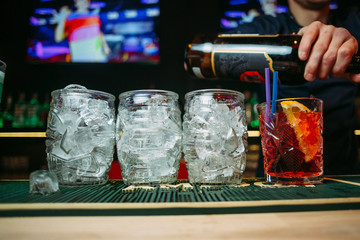 bartender makes cocktails in a restaurant