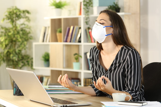 Freelance stress relieving doing yoga avoiding covid-19 at homeoffice - Powered by Adobe