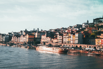 Fototapeta na wymiar Panoramic landscape view on the old town with Douro river in Porto city during the sunset in Portugal
