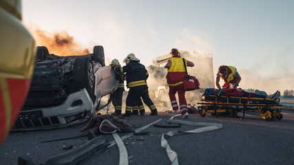 Paramedics and Firefighters Arrive On the Car Crash Traffic Accident Scene. Professionals Rescue...