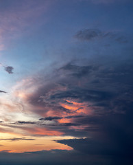 Image of the evening sky. Sunset. Beautiful clouds. Sunlight breaks through the clouds. Landscape