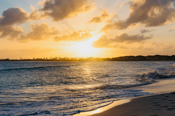 sunset palm trees on white sand tropical island of Anguilla