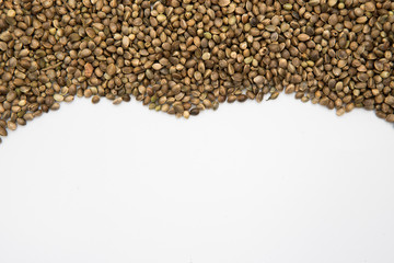 Hemp seed background. Close up shot of seeds showing the texture with copy space