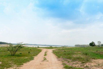 Obraz premium Car route heading to the river. The road that is revealed in the summer Scenery of Ang Kep Nam Dok Krai Rayong Thailand.