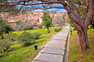 Saint Tropez, French riviera. Town of Saint Tropez green park walkway and architecture view