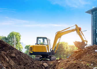 Obraz premium Excavators excavate earth at the construction site
