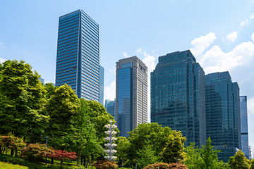 Fototapeta premium Central park lawn and financial center office building, Chongqing, China