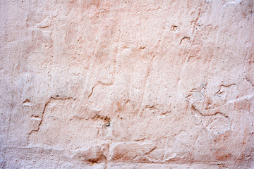 Texture of a concrete wall with cracks and scratches which can be used as a background