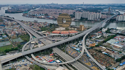 Fototapeta premium Guangzhou Yuan is the tallest circular building in the world. Huge donut on the banks of the Zhujiang River in Guangzhou 