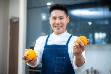 People are showing vegetables and fruits in the kitchen for healthy cooking.