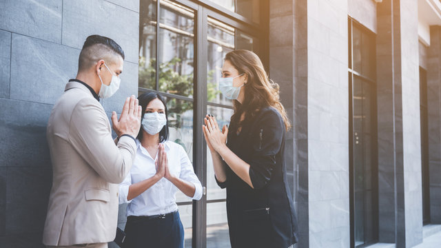 Business worker masked for meeting coworkers team, COVID-19 coronavirus protection concept by face mask