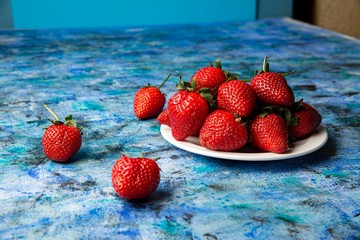 red strawberries on a blue background
