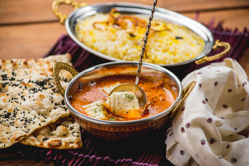 Traditional indian cuisine naan curry masala biryani rice kitchen towel panir