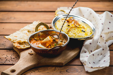 Traditional indian cuisine naan curry masala biryani rice kitchen towel panir