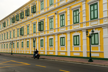 Fototapeta na wymiar Old classical yellow building facade in Bangkok Thailand.