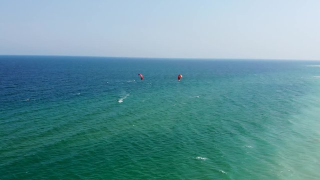 Two men kitesurfing in Bulgaria on one of the most beautiful seas in the world - the Black Sea.