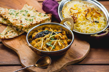 Traditional indian cuisine naan curry masala biryani rice kitchen towel panir