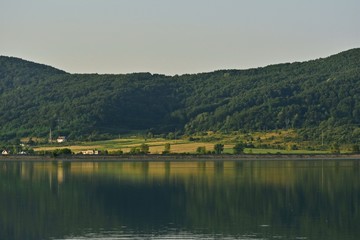 Fototapeta na wymiar lake reflection water forest summer fields harvest