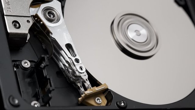 Macro, Close-Up of Actuator Arm of Computer Hard Disk Drive in Work. 4k