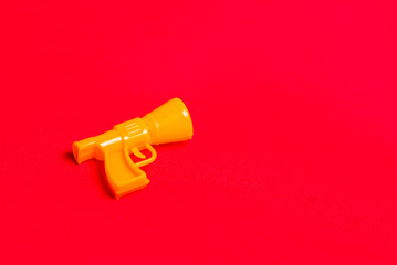 Yellow whistle on a red background