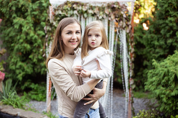 Mother and daughter having fun in the garden