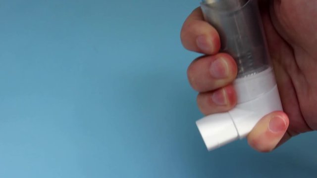 World Asthma Day May 5.anti-asthma inhaler on a blue background