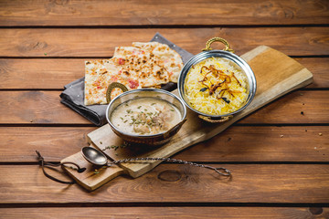 Traditional indian cuisine naan curry masala biryani rice kitchen towel panir