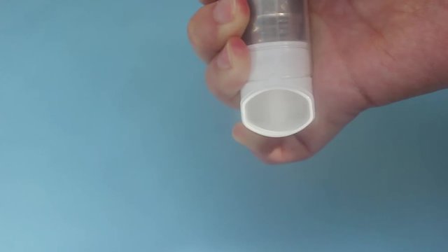 World Asthma Day May 5.anti-asthma inhaler on a blue background