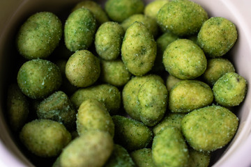 A close up of bright green Wasabi peas