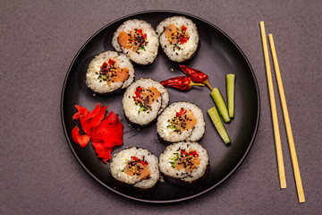 Korean roll Gimbap(kimbob). Steamed white rice (bap) and various other ingredients. Trendy black background