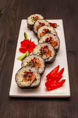 Korean roll Gimbap(kimbob). Steamed white rice (bap) and various other ingredients. Trendy black background