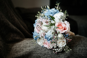 Wedding bridal bouquet with white, roses, daisies and red berries