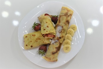 Crepes with banana and  strawberry 