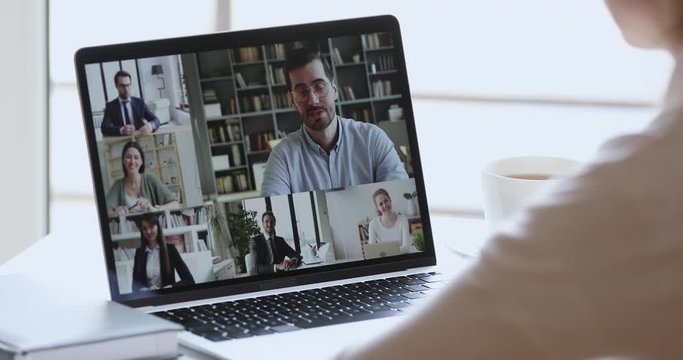 Business woman remote worker, distance student video conference calling by web cam group virtual chat. Online coaching, elearning and live business training concept. Over shoulder laptop screen view